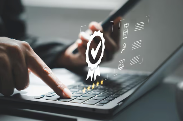 man typing on computer for certification